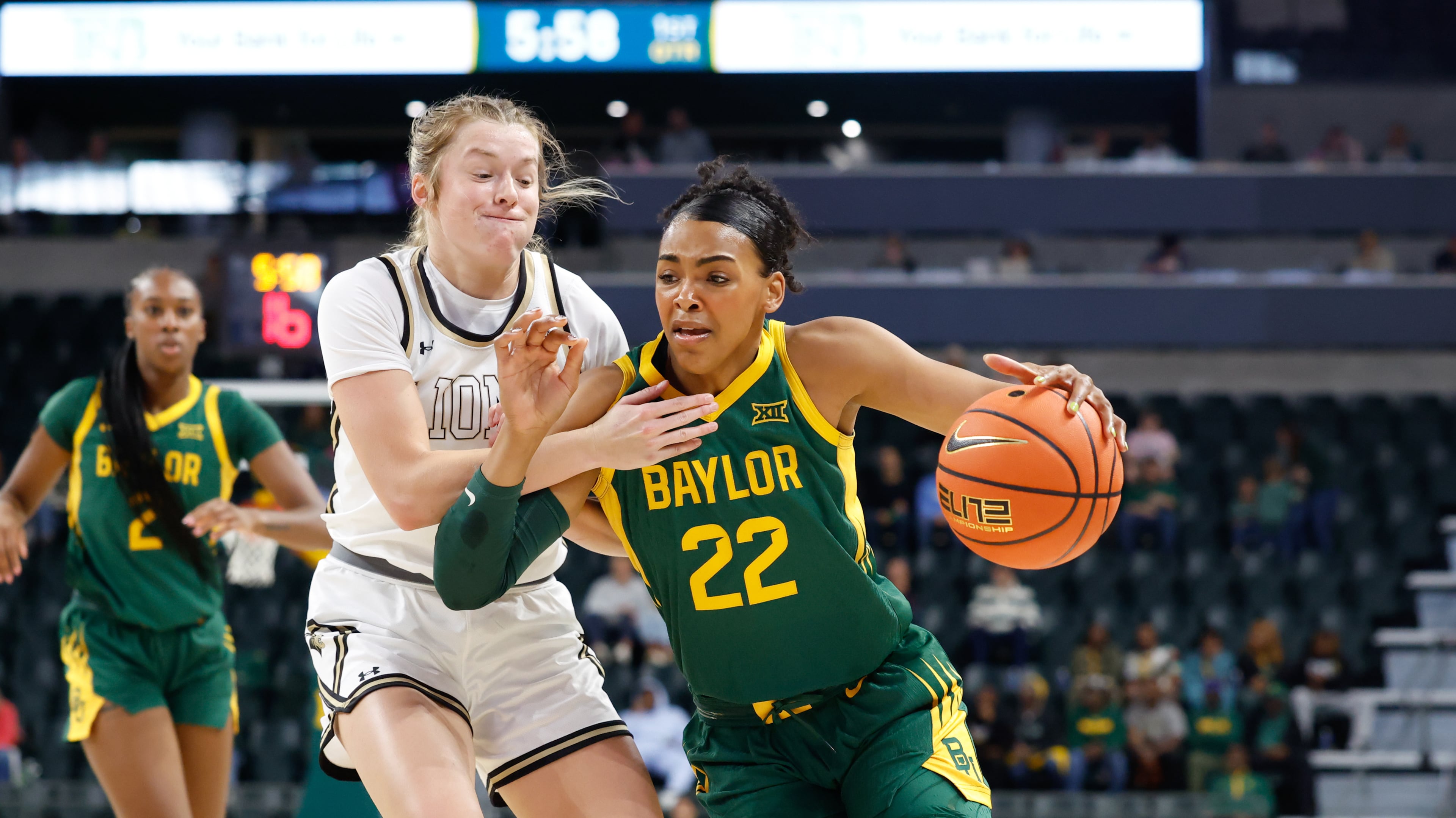 Baylor forward Bella Fontleroy (22) drives to the basket against Lindenwood guard Ellie Brueggemann, front left, in the first half of an NCAA college basketball game, Sunday, Nov. 9, 2025, in Waco, Texas. (Chris Jones/Waco Tribune-Herald via AP)