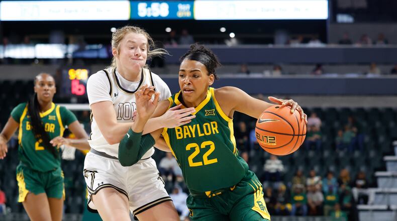 Baylor forward Bella Fontleroy (22) drives to the basket against Lindenwood guard Ellie Brueggemann, front left, in the first half of an NCAA college basketball game, Sunday, Nov. 9, 2025, in Waco, Texas. (Chris Jones/Waco Tribune-Herald via AP)