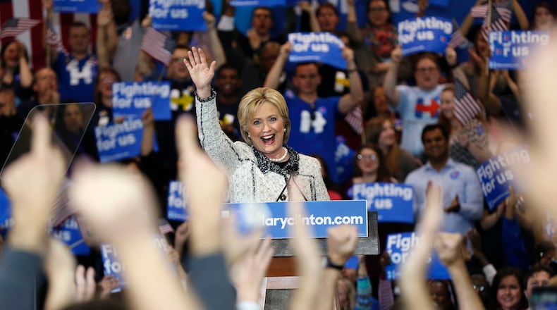 Democratic presidential candidate Hillary Clinton hugs Rep. James Clyburn, D-S.C., at her election night watch party after winning the South Carolina Democratic primary in Columbia, S.C., Saturday, Feb. 27, 2016. (AP Photo/Gerald Herbert)