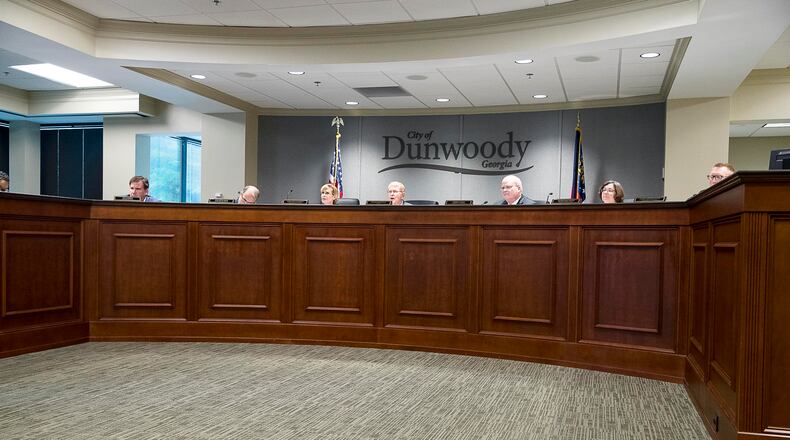 Terry Nall and Lynn Deutsch, on the right side of this photo, sit next to each other on the City Council. They are both running for mayor of Dunwoody. (Alyssa Pointer/alyssa.pointer@ajc.com)