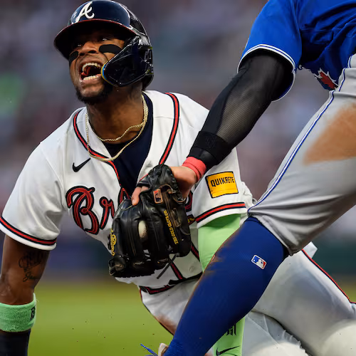FILE - Atlanta Braves' Ronald Acuña Jr. (13) steals third base against Toronto Blue Jays third baseman Kazuma Okamoto (7) in the fifth inning of a baseball game on June 3, 2026, in Atlanta. (AP Photo/Mike Stewart, File)