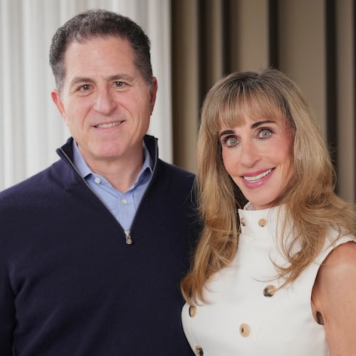 Michael and Susan Dell pose for photographs Nov. 26, 2025, in New York. (AP Photo/Frank Franklin II)