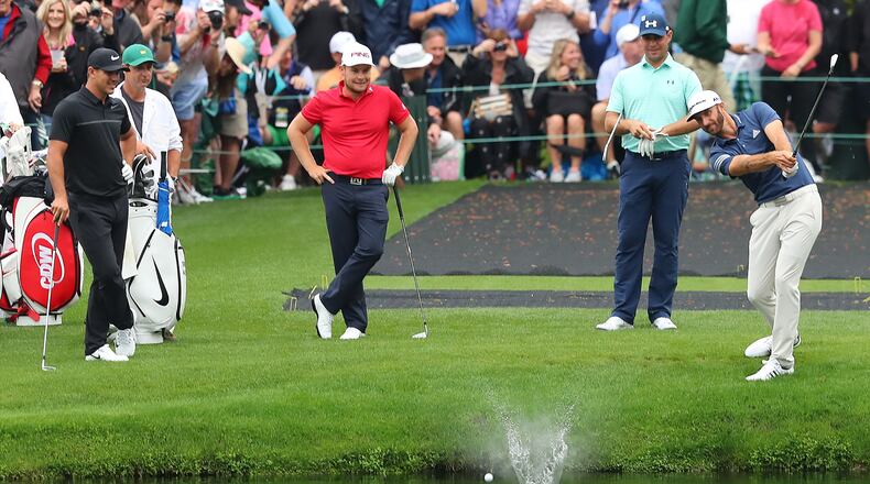 April 3, 2017, Augusta: Brooks Koepka (from left), Tyrell Hatton, and Gary Woodland look on as Dustin Johnson skips his ball across the pond to the 16th green during their practice round at Augusta National Golf Club on Monday, April 3, 2017, in Augusta. Curtis Compton/ccompton@ajc.com