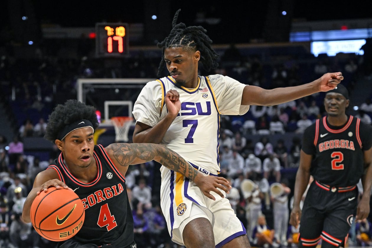 Georgia guard Marcus Millender (left) drives the ball around LSU guard PJ Carter (right) during an NCAA college basketball game, Saturday, Feb. 7, 2026, in Baton Rouge, La. (Hilary Scheinuk/The Advocate via AP)