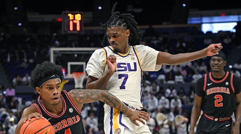Georgia guard Marcus Millender (left) drives the ball around LSU guard PJ Carter (right) during an NCAA college basketball game, Saturday, Feb. 7, 2026, in Baton Rouge, La. (Hilary Scheinuk/The Advocate via AP)