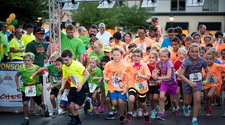 Young runners sporting all sorts of glow-in-the-dark accessories will be part of this year’s “Light up the Corners” evening run in Peachtree Corners. Contributed by David Winters
