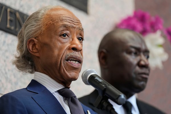 Rev. Al Sharpton, left, speaks with Attorney Ben Crump during a memorial service on the anniversary of George Floyd's death on Sunday, May 25, 2025, in Houston. (AP Photo/Ashley Landis)