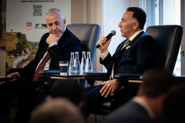Jim Vena, CEO of Union Pacific Railroad and Union Pacific Corp. (left) and Mark R. George, CEO of Norfolk Southern, speak during a joint presentation at Railway Age’s Next Generation Freight Rail conference at the Union League Club of Chicago on March 10, 2026, in Chicago. (Jamie Kelter Davis for the AJC)
