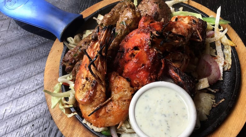 The tandoori mixed grill at Blue India comes loaded with king prawns, chicken, and two kinds of lamb kebab. CONTRIBUTED BY WYATT WILLIAMS