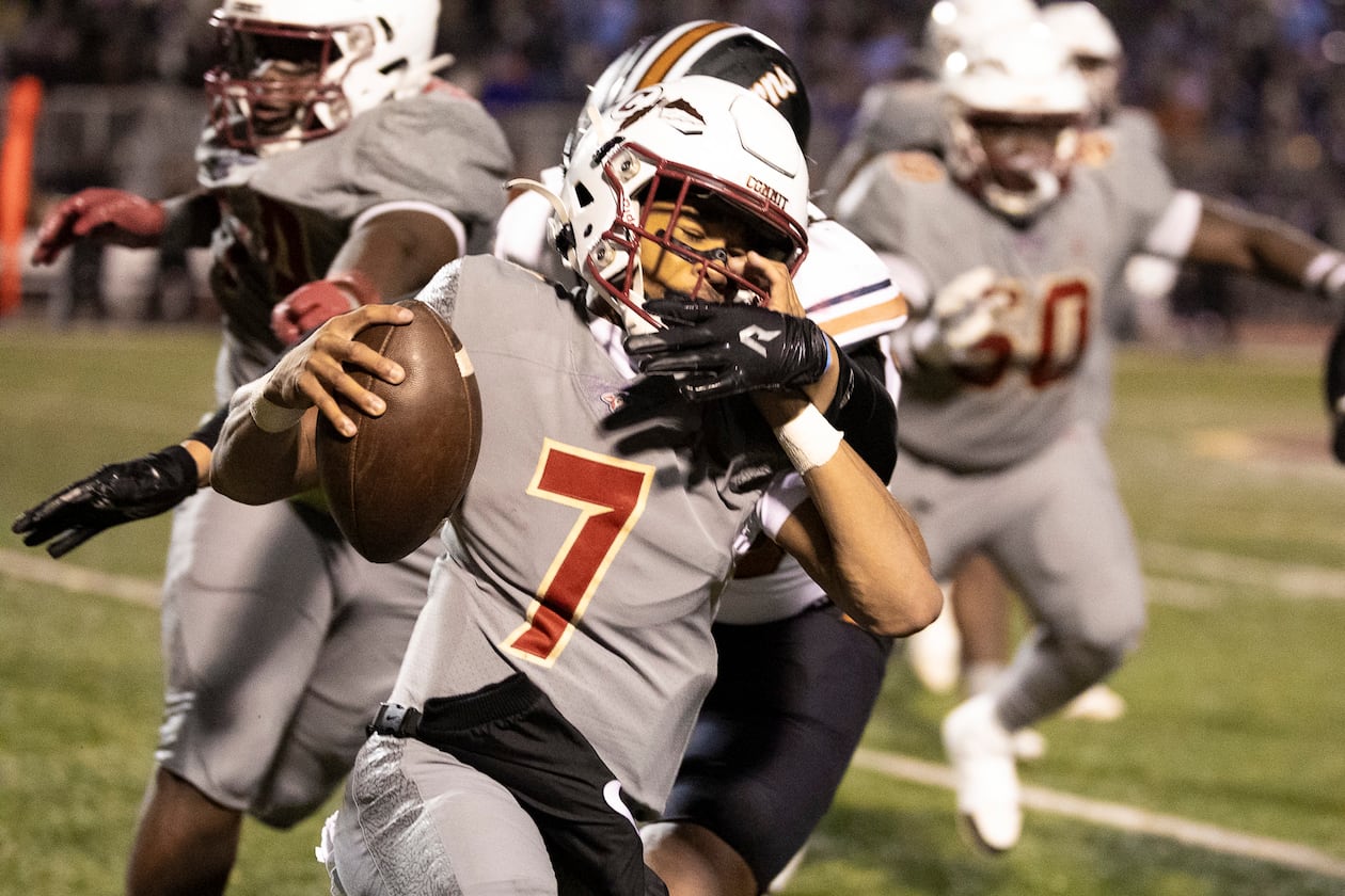 Creekside quarterback Cayden Benson (7) gets tackled during the first half of the class 4A semifinal against Kell at Creekside High School in Fairburn, GA on Friday, December 5, 2025. (Oscar Guevara Saenz for the AJC)