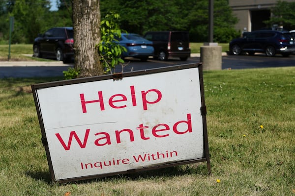 A "Help Wanted" sign is displayed at Illinois Air Team Test Station Saturday, June 21, 2025, in Lincolnshire, Ill. (AP Photo/Nam Y. Huh)