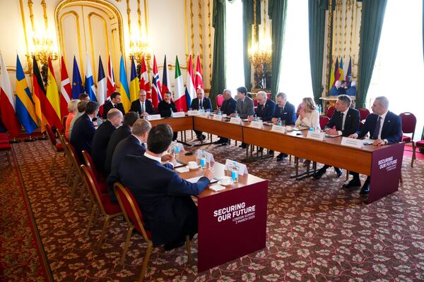 Canada Prime Minister Justin Trudeau, sixth from right, looks towards British Prime Minister Keir Starmer and Ukrainian President Volodymyr Zelenskyy as they take part in a plenary during the Securing our Future Summit on Ukraine and European security at Lancaster House in London, Sunday, March 2, 2025. (Sean Kilpatrick/The Canadian Press via AP)