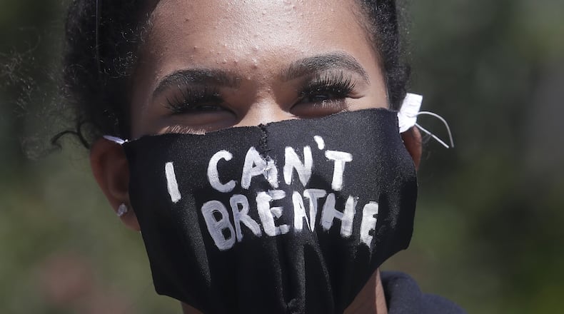 Tiana Day wears a mask that reads I Can’t Breathe before speaking in San Francisco June 6, 2020, at a protest over the Memorial Day death of George Floyd. AP PHOTO / JEFF CHIU