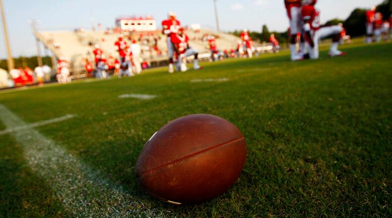 Following installation of a new turf field at Sandy Creek High School, Fayette County is putting turf at its remaining four stadiums. AJC file photo