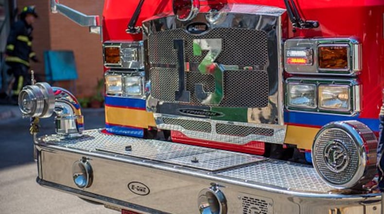 The firetruck overturned after colliding with a car Tuesday evening as crews responded to an emergency call.