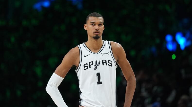 San Antonio Spurs forward Victor Wembanyama (1) waits for play to resume during the first half of Game 3 of a NBA basketball second-round playoff series against the Minnesota Timberwolves in Minneapolis, Friday, May 8, 2026. (AP Photo/Abbie Parr)