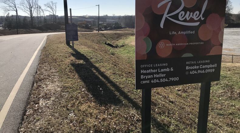 A sign advertising the Revel development outside a construction site near Gwinnett’s Infinite Energy Campus. Revel’s developer, North American Properties, announced Tuesday it was pulling out of the project. TYLER ESTEP / TYLER.ESTEP@AJC.COM