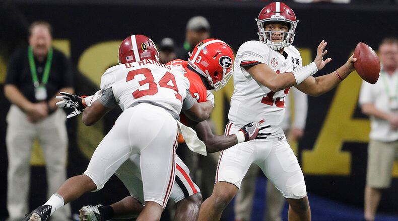 Alabama quarterback Tua Tagovailoa drops back to pass during the second half of the NCAA college football playoff championship game against Georgia Monday, Jan. 8, 2018, in Atlanta. (AP Photo/David J. Phillip)
