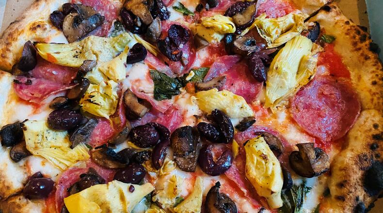 Amori Mio pizza with fresh mozzarella, roasted artichokes, salami, mushrooms, black olives, Pecorino Romano and basil.
Courtesy of Bob Townsend