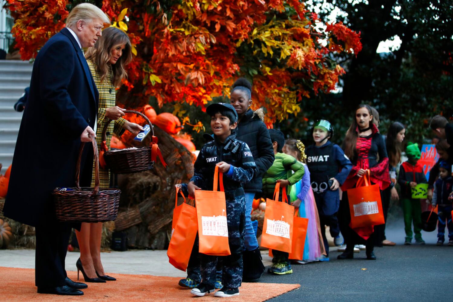 Photos: President Trump, first lady Melania Trump welcome children to White House for Halloween