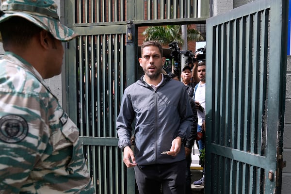 Juan Requesens, former opposition lawmaker and candidate for governor of Miranda state, arrives to a polling station during legislative and local elections in Caracas, Venezuela, Sunday, May 25, 2025. (AP Photo/Ariana Cubillos)