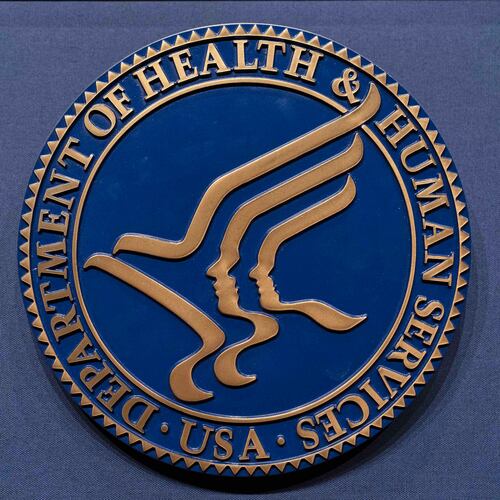 FILE = The Health and Human Services seal is seen before the news conference of Secretary Robert F. Kennedy Jr. at the Hubert Humphrey Building Auditorium in Washington, Wednesday, April 16, 2025. (AP Photo/Jose Luis Magana, File)