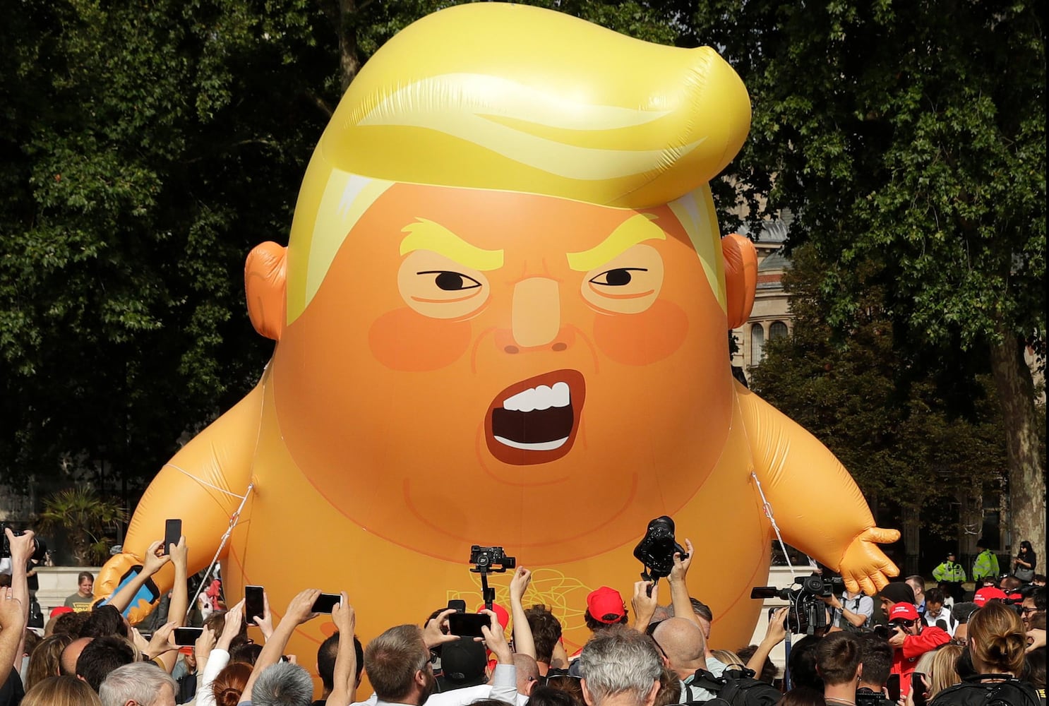 Photos: Baby Trump balloon flies over London protests