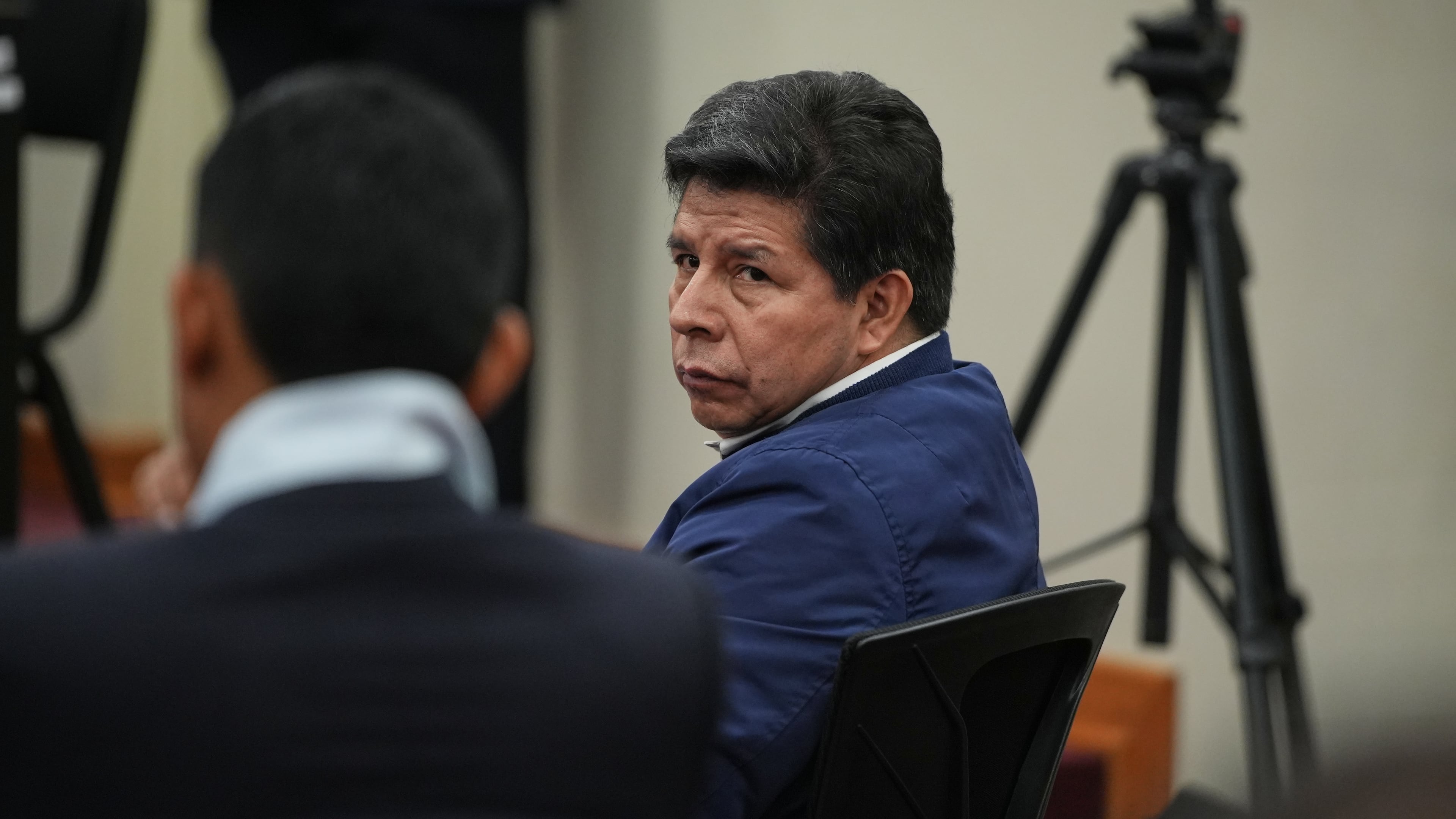 Former President Pedro Castillo, who faces charges of rebellion and other crimes against the state, attends his sentence hearing at a police base on the outskirts of Lima, Peru, Thursday, Nov. 27, 2025. (AP Photo/Guadalupe Pardo)