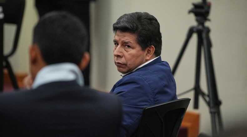 Former President Pedro Castillo, who faces charges of rebellion and other crimes against the state, attends his sentence hearing at a police base on the outskirts of Lima, Peru, Thursday, Nov. 27, 2025. (AP Photo/Guadalupe Pardo)