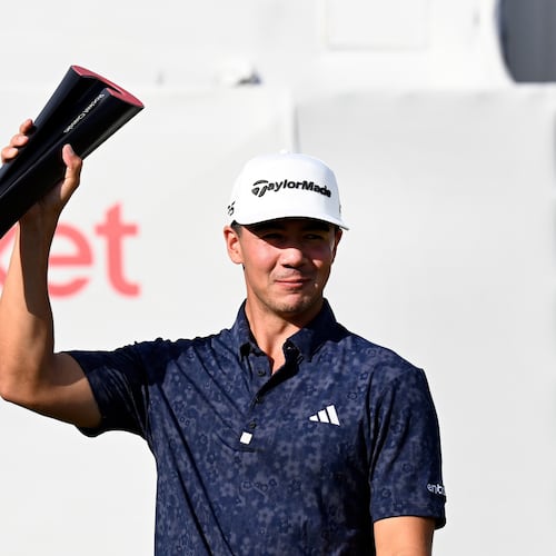 Michael Thorbjornsen hoists the trophy after winning the Rocket Classic golf tournament, Sunday, Aug. 2, 2026, in Detroit. (AP Photo/Jose Juarez)