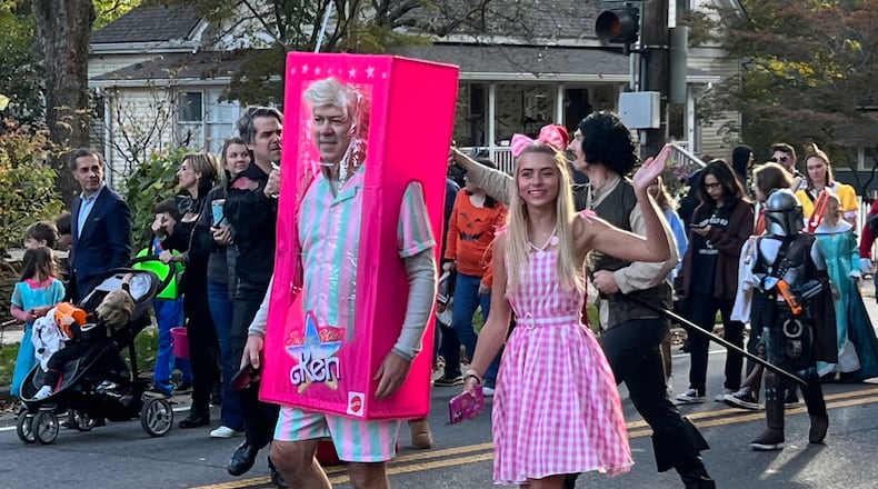 Barbie, shown here with Ken at the 2023 Marietta Halloween parade, was popular this year.