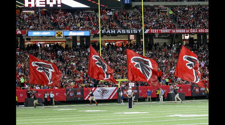 <p>Atlanta Falcons flag crew celebate after a touchdown during the NFL game between the New Orleans Saints and the Atlanta Falcons on January 01, 2017, at the Georgia Dome in Atlanta, Ga. The falcons defeat the Saints 38-32.</p>