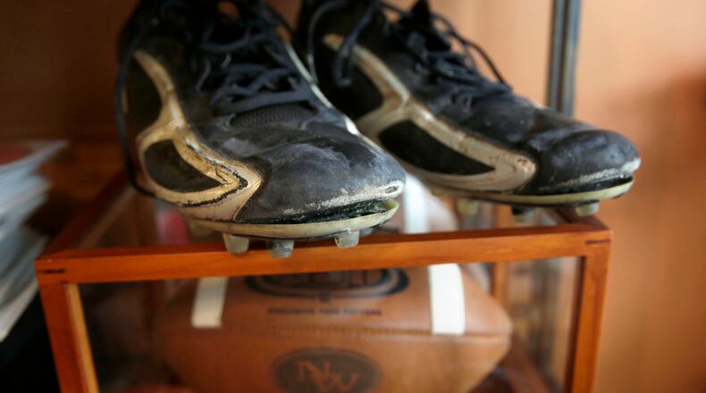 The old high school cleats of Shawn Afryl are seen at the family's home in Skokie, Ill., on Tuesday, Sept. 8, 2015. (Stacey Wescott/Chicago Tribune/TNS)