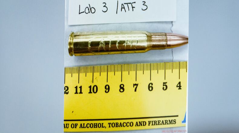 An image of a bullet casing engraved with the word "Catch!" is displayed during a preliminary hearing for Tyler Robinson, who is accused in the fatal shooting of Charlie Kirk, at the Fourth District Courthouse in Provo, Utah, Thursday, July 9, 2026. (AP Photo/Spenser Heaps, Pool)
