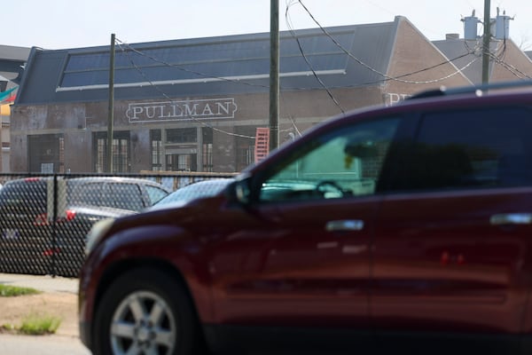 A vehicle travels on Rogers Street next to Pullman Yards, Tuesday, June 30, 2026. (Jason Getz/AJC)