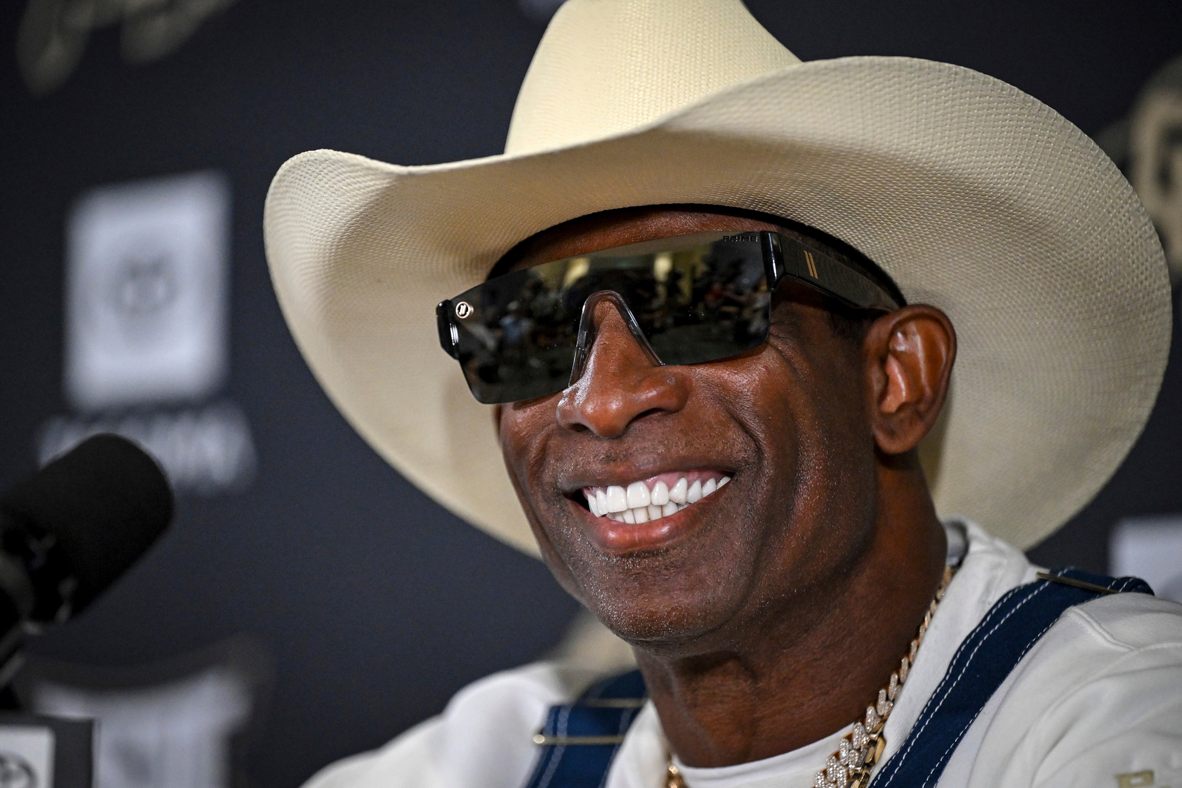 Colorado coach Deion Sanders smiles before speaking about his journey in beating bladder cancer during a press conference Monday, July 28, 2025, in Boulder, Colo. (AAron Ontiveroz/The Denver Post via AP)