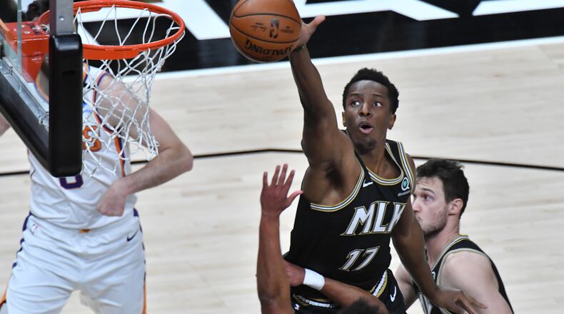 May 5, 2021 Atlanta - Atlanta Hawks forward Onyeka Okongwu (17) blocks a shot by Phoenix Suns forward Cameron Johnson (foreground) during the first half in an NBA basketball game at State Farm Arena on Wednesday, May 5, 2021. (Hyosub Shin / Hyosub.Shin@ajc.com)