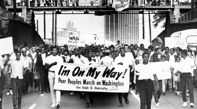 Sign-carrying participants in the Southern leg of the Poor People's Campaign march through Atlanta in their march toward Washington in May 1968.