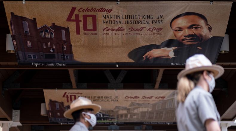 201010-Atlanta- Some of the banners that make up the new exhibit at the Martin Luther King Jr. National Historic Park hang outside of the visitors center on Saturday, October 10, 2020, in Atlanta during a ribbon-cutting ceremony to honor the park’s 40th anniversary and to open a nearly completed outdoor exhibit. (Photo: Ben Gray for The Atlanta Journal-Constitution)