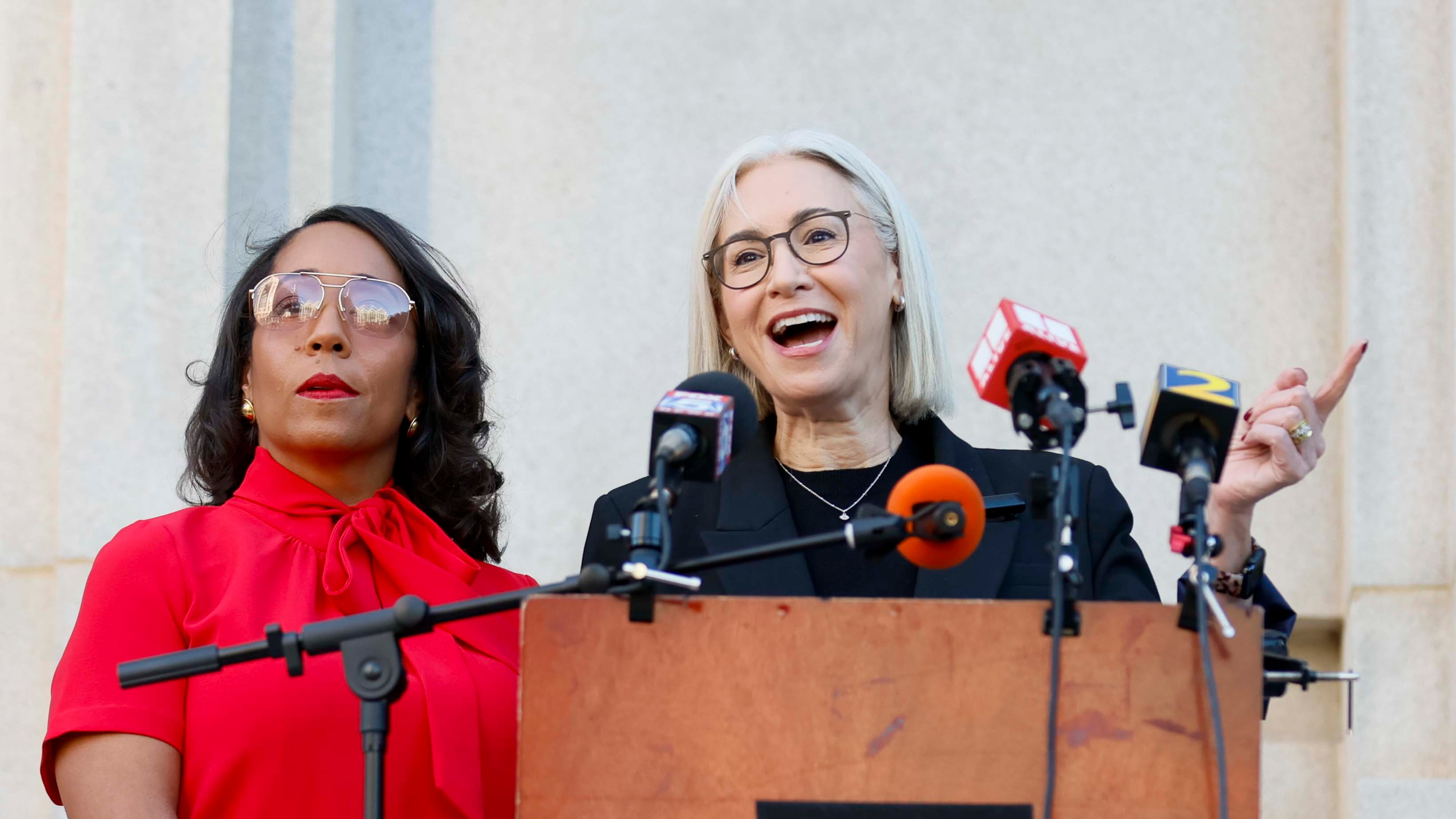 Democratic Commissioners Dana Barrett (right) and Mo Ivory speak during a press conference outside the Fulton County Superior Court on Wednesday, August 27, 2025. The election board's Democratic majority is in an ongoing legal dispute with the Fulton Republican Party over nominations. (Miguel Martinez/AJC)