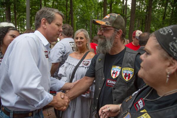 Secretary of State Brian Kemp shakes hands with a potential voter at a rally at the Roswell City Hall on  Sunday, July 22, 2018. (Photo: STEVE SCHAEFER / SPECIAL TO THE AJC)