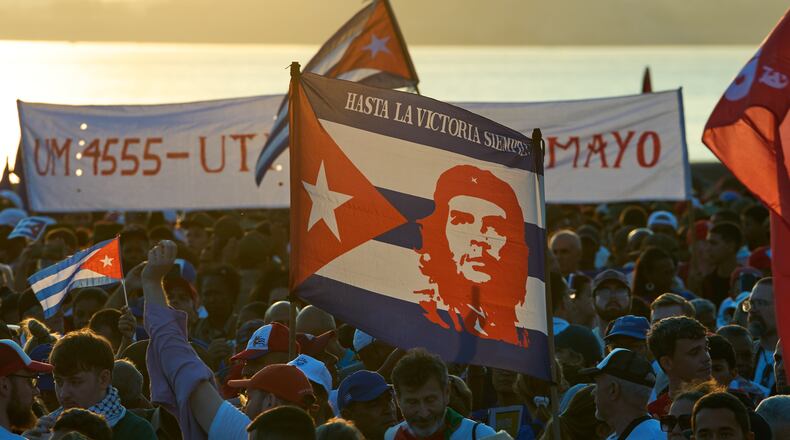 People attend a march marking International Workers' Day at Jose Marti Anti-Imperialist Square in Havana, Cuba, Friday, May 1, 2026. (AP Photo/Ramon Espinosa)