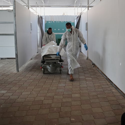 Bodies of unidentified Palestinians returned from Israel as part of the ceasefire deal are brought to Nasser Hospital in Khan Younis, Gaza Strip, Saturday, Nov. 8, 2025. (AP Photo/Abdel Kareem Hana)