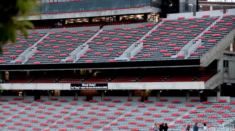 Georgia students and visitors look over socially distanced seats Georgia has put into place for the team’s home opener against Auburn in Sanford Stadium that will have limited capacity for fans. Curtis Compton / Curtis.Compton@ajc.com