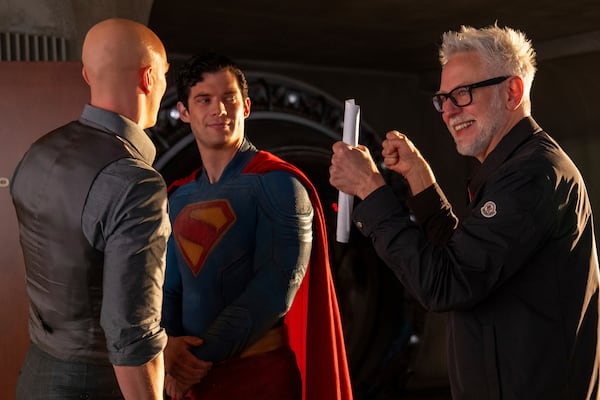 This image released by Warner Bros. Pictures shows Nicholas Hoult as Lex Luthor (left), David Corenswet as Superman and director James Gunn on the set of "Superman." (Jessica Miglio/Warner Bros. Pictures via AP)