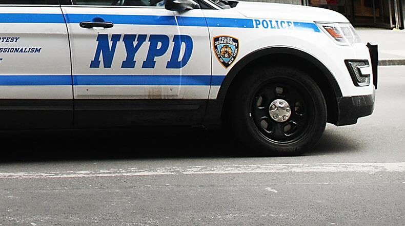 Video from a local news station shows a man in handcuffs jump out of an open window of an NYPD police car, similar to the one pictured.
