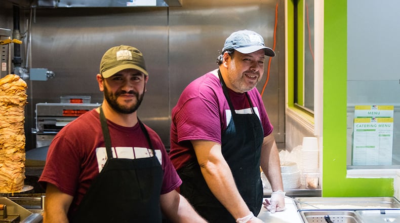Mohomad Gehad Aldara (left) and Samer Tammour (right) at Shami Kitchen in Sandy Springs. CONTRIBUTED BY HENRI HOLLIS