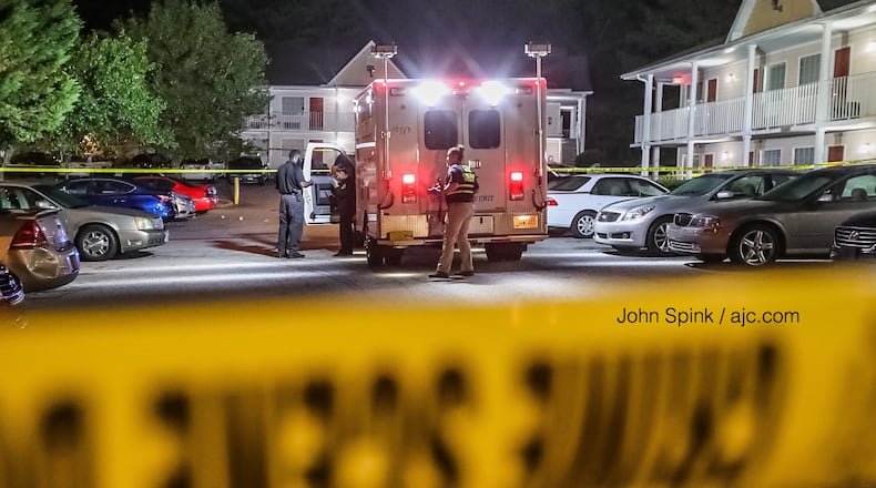 GBI agents process the scene of a shooting Monday morning at the Home Stay Suites off Ga. 85 in Riverdale.