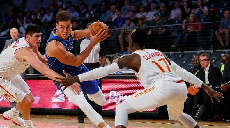 Ersan Ilyasova (left) and Dennis Schroder are out vs. the Heat. (Photo by Kevin C. Cox/Getty Images)
