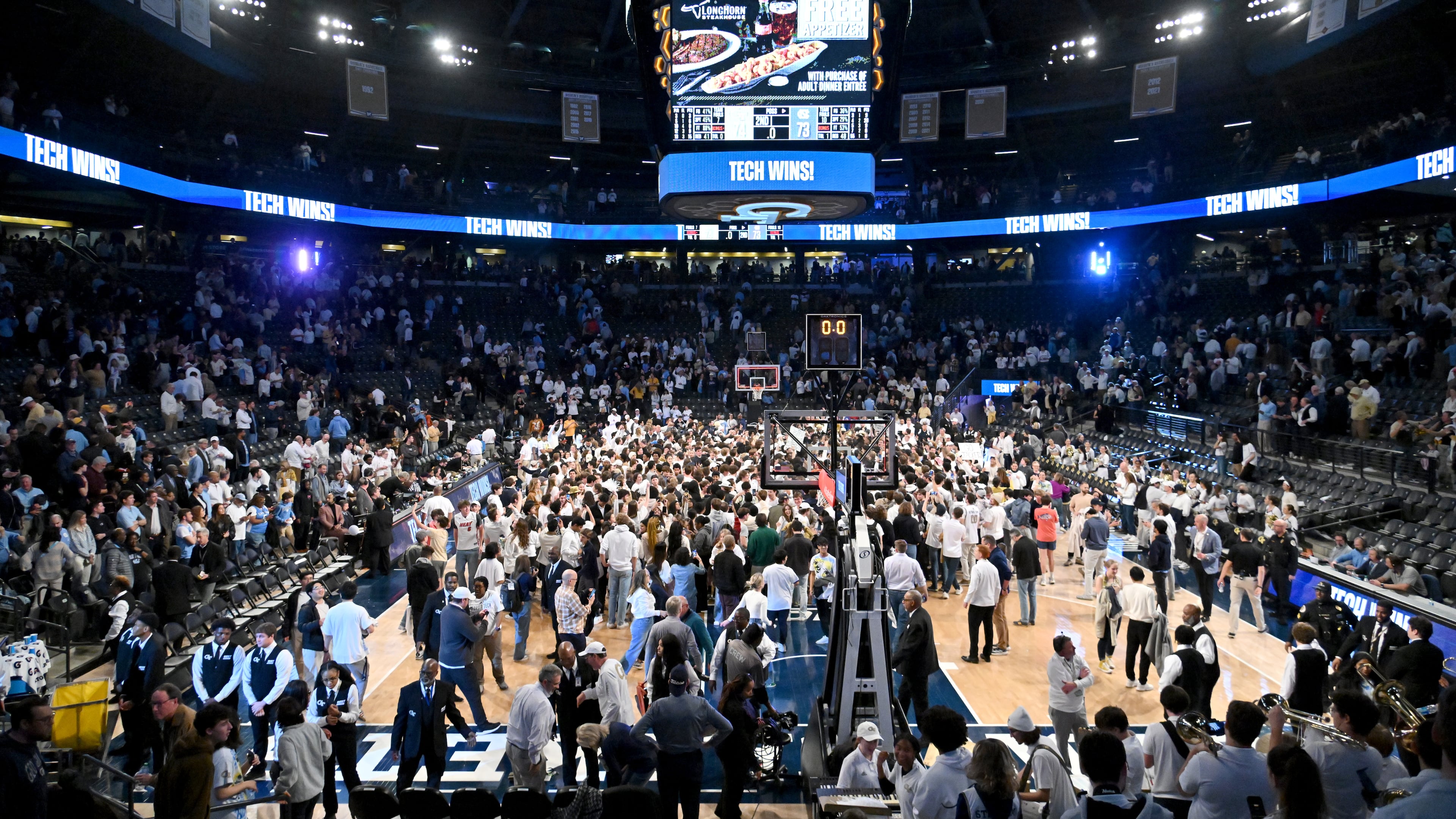 Fans storm the court after a Georgia Tech victory at McCamish Pavilion. Yellow Jackets athletics has hired an executive director of basketball operations and player management. (Hyosub Shin/AJC)